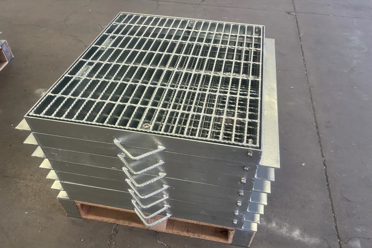 Stacked framed trench cover grating panels