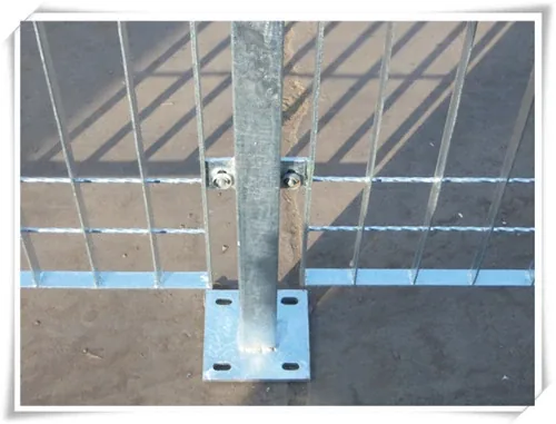 Grating fence post fixed to a slotted base plate