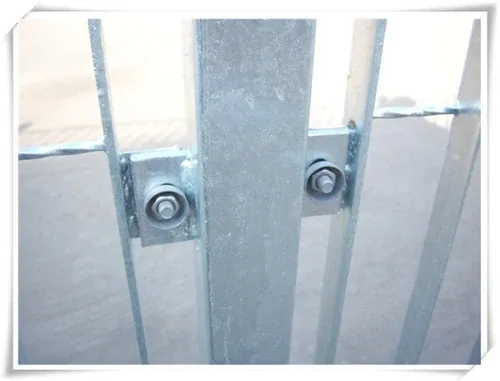 Close view of a grating fence post bracket and bolt connection