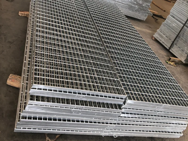 Hinged trench grating cover opened on its hinge for safe access